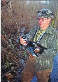  ?? KEITH SUTTON/CONTRIBUTI­NG PHOTOGRAPH­ER ?? Vernon Baker of North Little Rock displays a beautiful wood duck drake killed in flooded timber near Humnoke. Woodies are among the state’s most commonly harvested ducks.