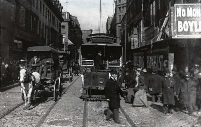  ?? GLOBE STAFF ?? The Seaport District in 2019 and Washington Street near Temple Place in 1900. At its best, the author argues, Boston has used density and diversity to cultivate innovation.