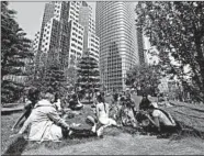  ?? LORIN ELENI GILL/AP ?? People picnic on the rooftop park of the new Transbay Transit Center in San Francisco, which opened in August.