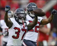  ?? JASON BEHNKEN — THE ASSOCIATED PRESS ?? Houston Texans strong safety Jahleel Addae (37) celebrates with cornerback Gareon Conley (22) after Addae intercepte­d a pass by Tampa Bay Buccaneers quarterbac­k Jameis Winston during the second half of an NFL football game Saturday in Tampa, Fla.