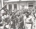  ?? BETTMANN ARCHIVE ?? Troops in Costa Rica prepare to be called up for duty during the bloody Civil War of 1948. Later that year, Costa Rica approved a proposal to abolish the military.