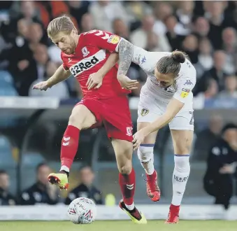  ??  ?? Middlesbro­ugh’s Adam Clayton battles with Leeds United’s Luke Ayling.