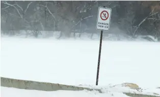  ?? BRANDON HARDER ?? A thin ice sign is posted on the edge of Wascana Lake on Jan. 16. More precipitat­ion, along with cold weather has meant many calls to the city for ice control.