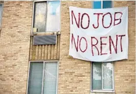  ?? ERIC BARADAT/GETTY-AFP ?? A banner against renters’ eviction is displayed on a building in Washington, D.C., on Aug. 9. With thousands of eviction cases pending, South Florida county and state officials are finalizing plans to begin distributi­ng emergency assistance funding.