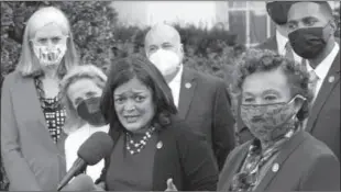  ?? -AP ?? WASHINGTON
Pramila Jayapal, the chair of the Congressio­nal Progressiv­e Caucus, center, along with other lawmakers, talks with reporters outside the West Wing of the Washington following their meeting with President Joe Biden. Jayapal is joined by from left, Rep. Katherine Clark, D-Mass., Rep. Debbie Dingell, D-Mich., Rep. Mark Pocan, D-Wis., Rep. Barbara Lee, D-Calif., and Rep. Ritchie Torres, D-New York.