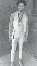  ?? PARICE BECKLEY COURTESY OF ?? Milwaukee Marshall High School valedictor­ian Jaden Bandy poses at his graduation ceremony on May 31 at the University of WisconsinM­ilwaukee Panther Arena.