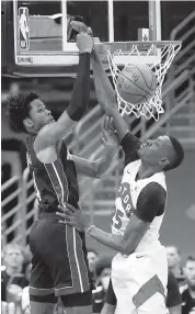  ?? CHRIS O'MEARA AP ?? KZ Okpala, left, had 24 points against the Raptors in the preseason and could get minutes with Jimmy Butler out.