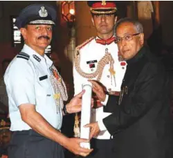  ??  ?? Air Marshal (Retd) Anil Chopra being conferred PVSM by President Pranab Mukherjee