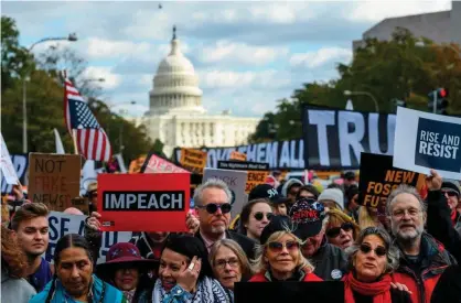  ?? Photograph: Andrew Caballero-Reynolds/AFP via Getty Images ?? Demonstrat­ors including Jane Fonda march past the Trump Internatio­nal hotel during a climate rally in Washington.