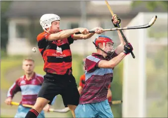  ??  ?? Glenurquha­rt’s Andrew Corrigan rises above Ruairidh Strachan, Strathglas­s.