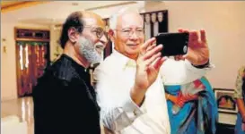  ?? PTI ?? Malaysian Prime Minister Najib Razak, who is on an official visit to India, clicks a selfie with Rajinikant­h at the Tamil superstar’s residence in Chennai on Friday.