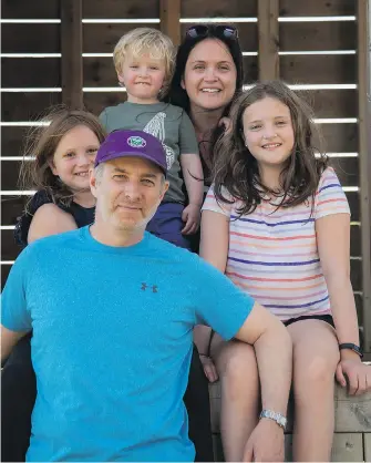  ?? THE CANADIAN PRESS ?? Karuna Satov, second from right, poses with her family, from left to right, Aili, 13; Mark, 48; Llewyn, 4; and Meryl, 13. The inequities between Meryl‘s public school and her younger siblings‘ private school will be especially stark this year amid the pandemic, Satov says.