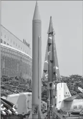  ??  ?? Replicas of a North Korean Scud-B missile (L) and a South Korean Nike missile (R) are displayed at the Korean War Memorial in Seoul on Monday.