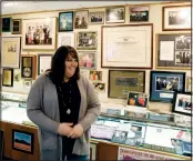  ?? (AP/Jay LaPrete) ?? Brandi Wilson, executive director of the Marion County Historical Society, talks Dec. 6 about the memorabili­a in the Mary Ellen Withrow exhibit.