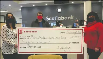  ?? NEWS PHOTO ?? Even during the pandemic the local Scotiabank branches continued a tradition of helping to raise funds for the Medicine Hat Santa Claus Fund and matching donations to a maximum of $15,000. In the photo from left to right: Nicole Pituley branch manager at the Scotiabank on Carry Drive, Bryce Andreasen, Scotia Securities downtown, and Deanna Doerksen, SCF executive director.