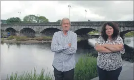  ?? (Photo: Katie Glavin) ?? Local activists William Hughes and Helen White by the banks of the River Blackwater in Fermoy.