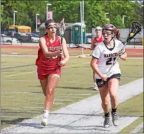  ?? RACHEL WISNIEWSKI — FOR DIGITAL FIRST MEDIA ?? Maddie Henderson (Harriton, right) fights to stay inbounds while Anna Annello (Souderton, left) stands guard Tuesday.