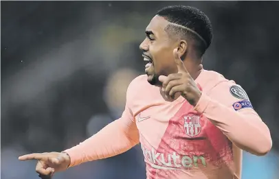  ?? Picture: AFP ?? IN THE NET. Barcelona’s Malcom celebrates after opening the scoring during their Champions League match against Inter Milan at the San Siro on Tuesday night. The game ended 1-1.