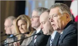  ?? NORM BETTS/ BLOOMBERG ?? Warren Jestin of the Bank of Nova Scotia, right, speaks during the Economic Club of Canada’s 2013 annual economic outlook breakfast in Toronto on Friday. Jestin and five other economists from top banks agreed the United States would lead growth in the...