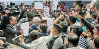  ?? PTI ?? Students of various colleges and universiti­es stage a protest in front of West Bengal Governor Jagdeep Dhankhar (CL) on his arrival at the Calcutta University in Kolkata on Tuesday. —