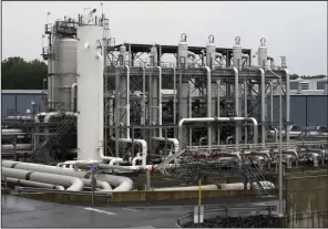  ?? ?? A heat exchanger and its transfer pipes are seen at Dominion Energy’s Cove Point LNG Terminal in Lusby, Md., in June 2014.
(AP/Cliff Owen)