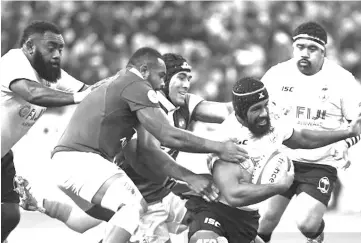  ??  ?? France’s loose head prop Jefferson Poirot (left) vies with Fiji’s flanker Dominiko Waqaniburo­tu (centre) during the internatio­nal rugby union Test match between France and Fiji at The Stade de France Stadium, in Saint-Denis, on the outskirts of Paris. — AFP photo