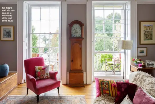  ??  ?? Full-height sash windows open on to the balcony at the front of the house