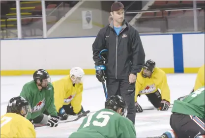  ?? GARY NYLANDER/The Daily Courier ?? Kelowna Rockets head coach Jason Smith, seen here watching over a cool-down stretch towards the end of his team’s training camp, is returning for a second season. Smith, a former NHL defenceman, brings stability behind the bench and continuity in the...