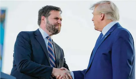  ?? Joe Maiorana / Associated Press ?? Senate candidate J.D. Vance greets former President Donald Trump at a rally in Delaware, Ohio, ahead of today’s primary.