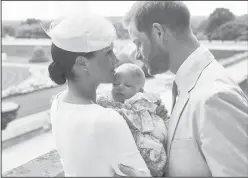  ?? Chris Allerton/©SussexRoya­l via AP ?? Family: This is an official christenin­g photo released by the Duke and Duchess of Sussex on Saturday, showing Britain's Prince Harry, right and Meghan, the Duchess of Sussex with their son Archie Harrison Mountbatte­n-Windsor at Windsor Castle with with the Rose Garden in the background, in Windsor, England.