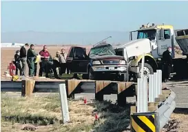  ?? KYMA VIA THE ASSOCIATED PRESS ?? Police and rescue personnel work at the scene of a deadly crash involving a semitruck and an SUV in Holtville, California, on Tuesday.