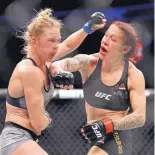  ?? JOHN LOCHER/ASSOCIATED PRESS ?? Cyborg, right, hits Holly Holm, who fights for Jackson-Wink, during their UFC featherwei­ght bout on Saturday. Jackson-Wink media coordinato­r Mark Aragon referred to Cyborg as a “he.”