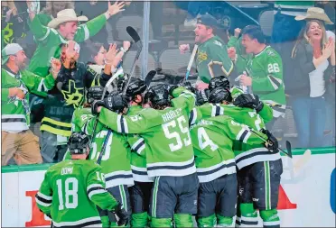  ?? GARETH PATTERSON/AP PHOTO ?? Dallas Stars celebrate Joe Pavelski’s overtime goal that lifted the Stars to a 3-2 victory in Game 4 on Thursday night in Dallas and kept the Vegas Golden Knights from sweeping the NHL Western Conference finals.