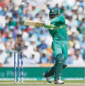  ?? — Reuters ?? Pakistan’s Fakhar Zaman plays a shot against India in Champions Trophy final at the Oval.