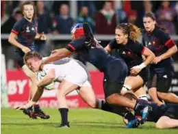  ?? —AFP ?? BELFAST: England’s Sarah Bern (L) is tackled by France’s Safi N’Diaye during the Women’s Rugby World Cup 2017 semi-final match between England and France at The Kingspan Stadium in Belfast on Tuesday.