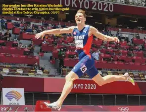  ?? (AFP) ?? Norwegian hurdler Karsten Warholm clocks 45.94sec to win 400m hurdles gold medal at the Tokyo Olympics.