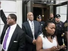  ?? MATT ROURKE — ASSOCIATED PRESS ?? Bill Cosby listens to his wife Camille’s statement being read aloud by Ebonee M. Benson outside the Montgomery County Courthouse after a mistrial in his sexual assault case in Norristown Saturday. Cosby’s trial ended without a verdict after jurors...