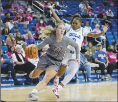  ?? Associated Press ?? UCLA guard Londynn Jones (3) defends against Washington State guard Johanna Teder (21) during the first half, Thursday, in Los Angeles. Washington State won 62-55.