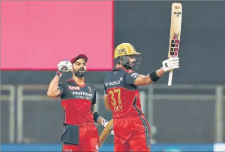  ?? BCCI ?? While RCB skipper Virat Kohli (L) became the first player to score 6,000 runs in IPL, left-hander Devdutt Padikkal hit his maiden league ton against RR on Thursday.