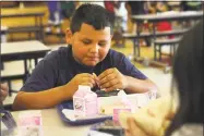  ?? Hearst Conneticut Media file photo ?? A boy enjoys lunch with friends as part of a summer meals program in Connecticu­t.