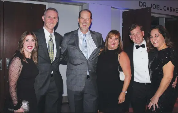  ?? (NWA Democrat-Gazette/Carin Schoppmeye­r) ?? Kelly Kemp-McLintock and Ben McLintock (from left), Jim and Holly Breach and Tony and Emi Cardarelli gather at Big Night at The Jones Center.