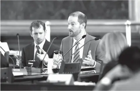  ?? Associated Press ?? ■ David J. Hacker, special counsel for litigation for the Texas attorney general’s office, right, and Brantley Starr, deputy first attorney general, left, take part in a committee meeting on religious freedom laws on Feb. 26 at the Texas Capitol in...