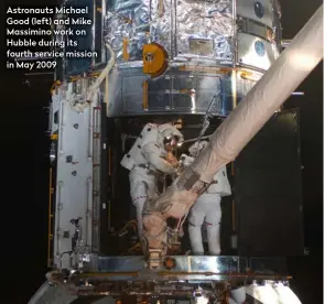  ??  ?? Astronauts Michael Good (left) and Mike Massimino work on Hubble during its fourth service mission in May 2009