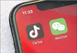  ?? Mark Schiefelbe­in Associated Press ?? THE TRUMP administra­tion wants to remove WeChat and any updates from U.S. app stores and prevent U.S. users from sending or receiving money on it.