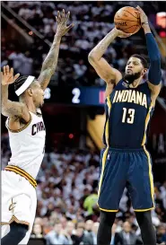  ?? AP/TONY DEJAK ?? Indiana guard Paul George (right) had 32 points, 8 rebounds and 7 assists Monday, but the Pacers came up short again against Cleveland and trail their best-of-7 series 2-0.