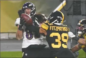  ?? The Associated Press ?? Pittsburgh Steelers free safety Minkah Fitzpatric­k (39) breaks up a pass in the end zone to Baltimore Ravens tight end Luke Willson (82) as time runs out in first half of Wednesday’s game in Pittsburgh. BREAKING UP IS EASY: