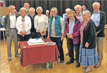  ??  ?? Some of the members of Oban U3A help cut the birthday cake to celebrate the group’s 10th anniversar­y.