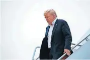  ?? [EVAN VUCCI/THE ASSOCIATED PRESS] ?? U.S. President Donald Trump arrives at Andrews Air Force Base Wednesday after a summit with North Korean leader Kim Jong Un in Singapore.