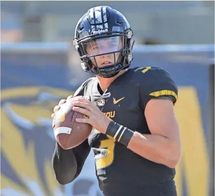  ?? DENNY MEDLEY/USA TODAY SPORTS ?? Missouri quarterbac­k Drew Lock, a potential first-round pick, likely would benefit from being able to sit while he works with an NFL coaching staff to iron out issues with his accuracy and mechanics.