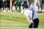  ?? DARRYL WEBB — THE ASSOCIATED PRESS ?? Adam Hadwin chips to the ninth green during the first round of the Phoenix Open on Thursday in Scottsdale, Ariz.